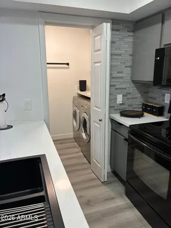 a kitchen with a refrigerator and a stove