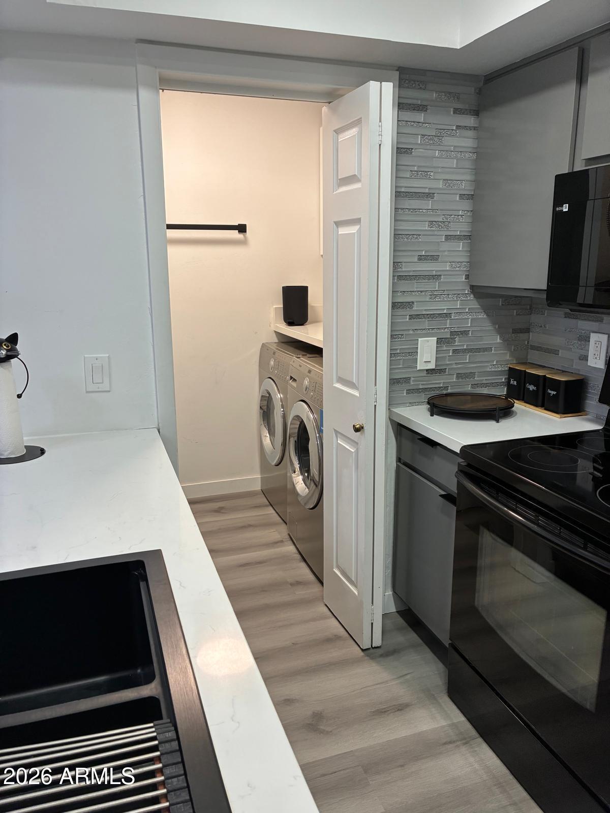 2815 North 52nd Street, Unit 3 Phoenix, AZ 85008 - Photo 4 of 7 a kitchen with a refrigerator and a stove
