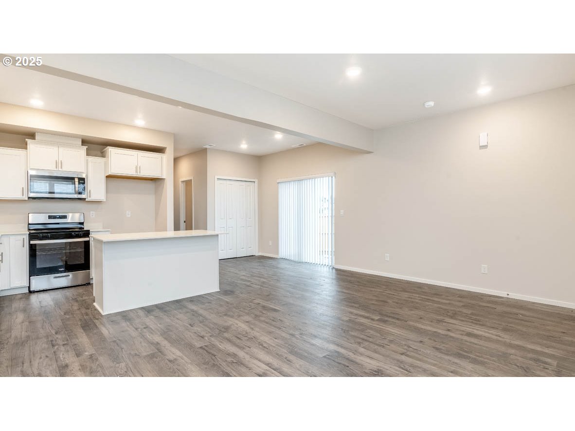 2994 T Street Springfield, OR 97477 - Photo 3 of 24 a room with stainless steel appliances wooden floor and view living room