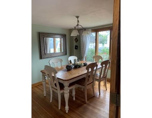 130 Pilgrim Road Weymouth, MA 02191 - Photo 3 of 14 a view of a dining room with furniture and wooden floor