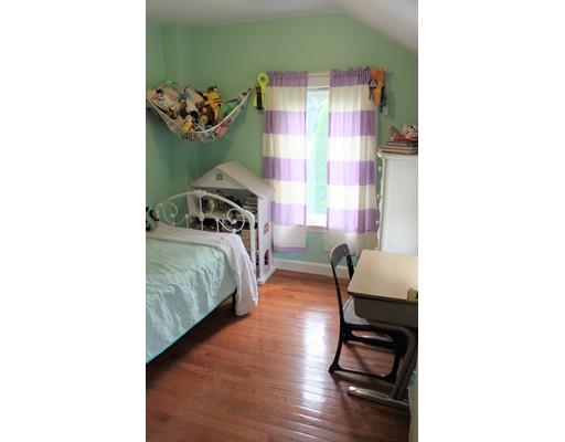 130 Pilgrim Road Weymouth, MA 02191 - Photo 8 of 14 a bedroom with a bed and a cabinets