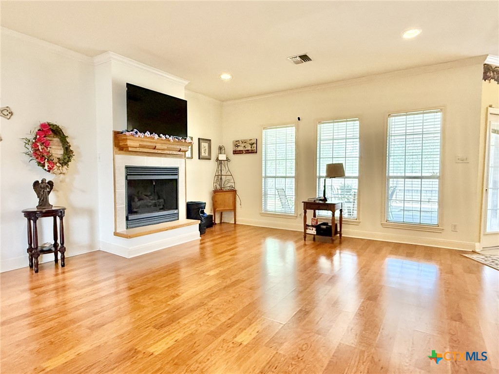 415 South Trinity Street Edna, TX 77957 - Photo 7 of 46 a living room with furniture and a fireplace