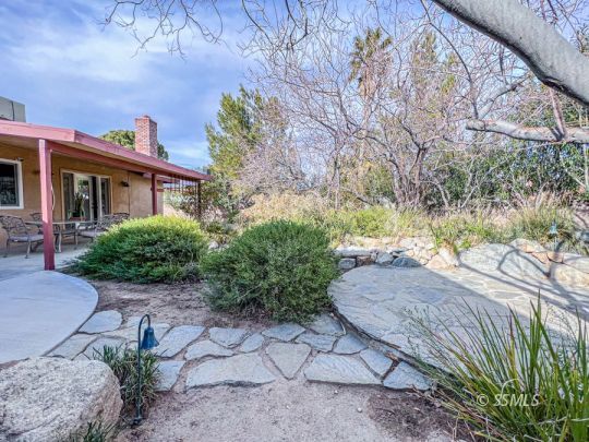 516 Randall Street Ridgecrest, CA 93555 - Photo 43 of 50 a view of backyard with a garden and plants