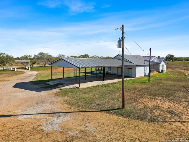 a view of a street with houses in the background