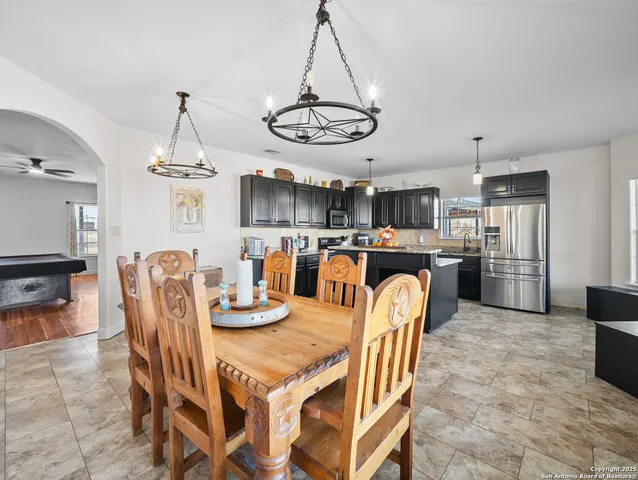 a dining room with furniture and window