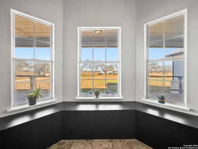 a kitchen with a sink a large window and a counter space
