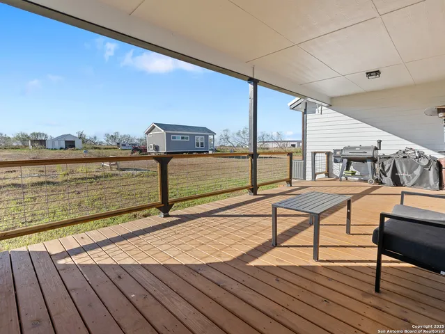 a view of a terrace with wooden benches
