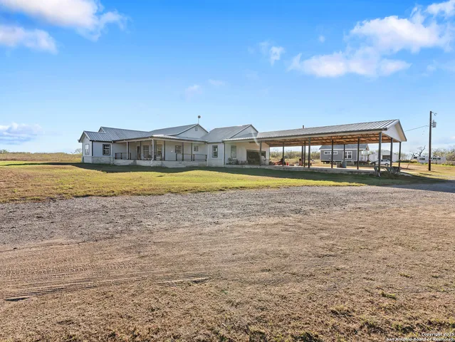 a view of a swimming pool and a yard