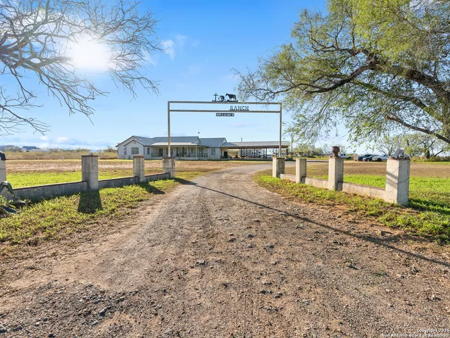 a view of a backyard with swimming pool