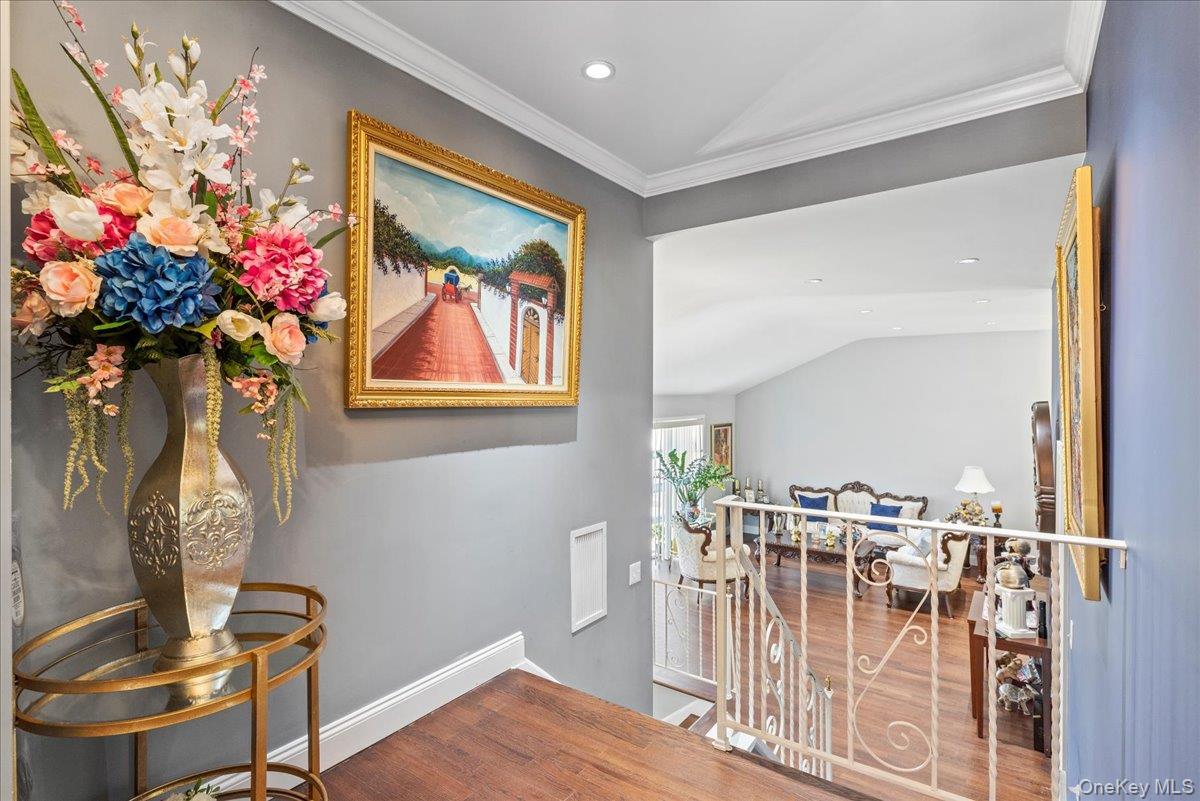 269 Hungry Harbor Road Valley Stream, NY 11581 - Photo 11 of 34 a view of a dining room with furniture wooden floor and a chandelier