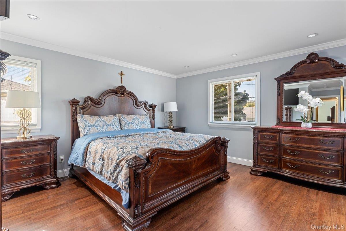 269 Hungry Harbor Road Valley Stream, NY 11581 - Photo 12 of 34 a bedroom with a bed and a dresser