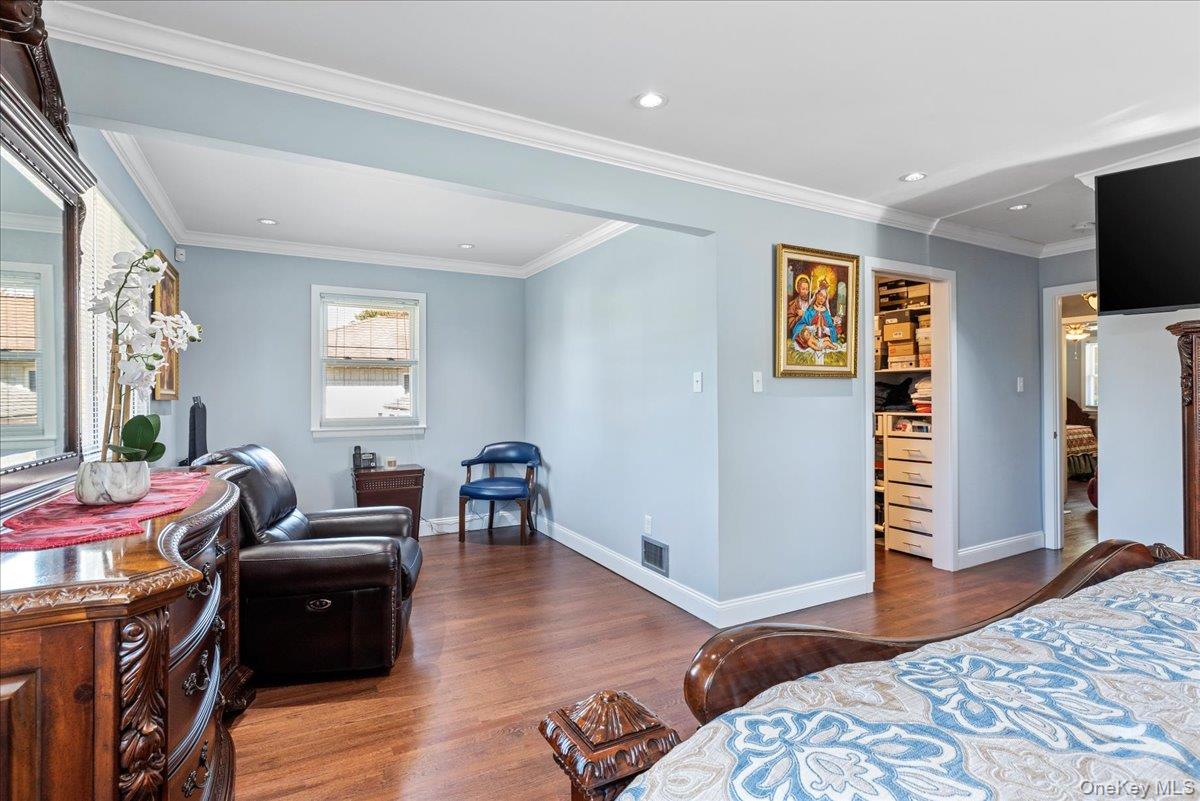 269 Hungry Harbor Road Valley Stream, NY 11581 - Photo 14 of 34 a bedroom with furniture and a wooden floor