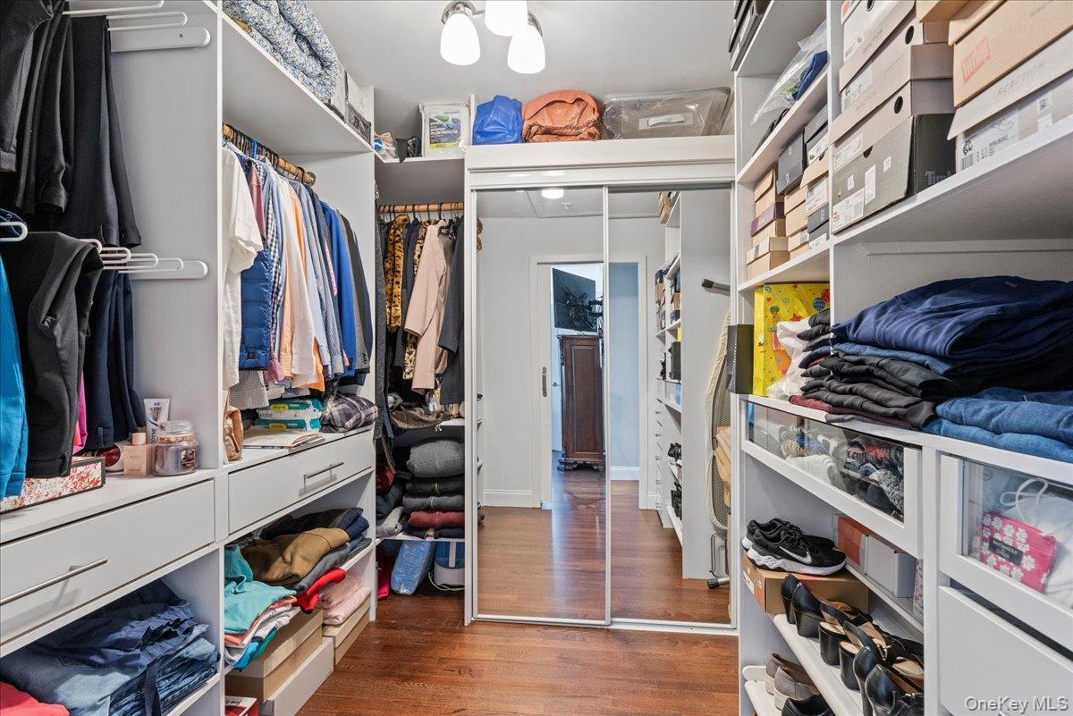269 Hungry Harbor Road Valley Stream, NY 11581 - Photo 16 of 34 a view of walk in closet with clothes and shoes