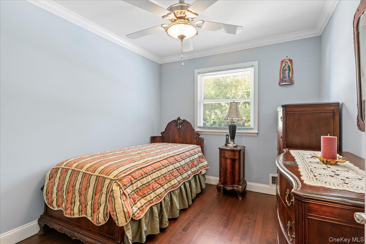 269 Hungry Harbor Road Valley Stream, NY 11581 - Photo 17 of 34 a bedroom with a bed and a window