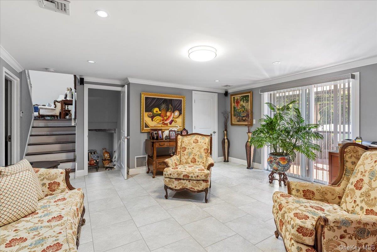 269 Hungry Harbor Road Valley Stream, NY 11581 - Photo 21 of 34 a living room with furniture and a large window