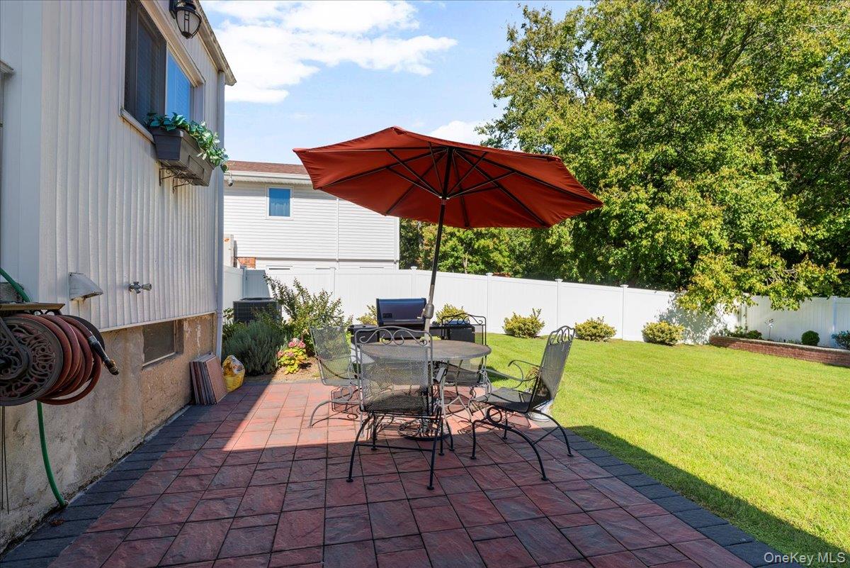 269 Hungry Harbor Road Valley Stream, NY 11581 - Photo 24 of 34 a view of backyard with seating space and trees