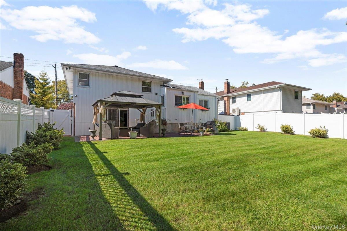 269 Hungry Harbor Road Valley Stream, NY 11581 - Photo 26 of 34 a front view of house with yard and outdoor seating
