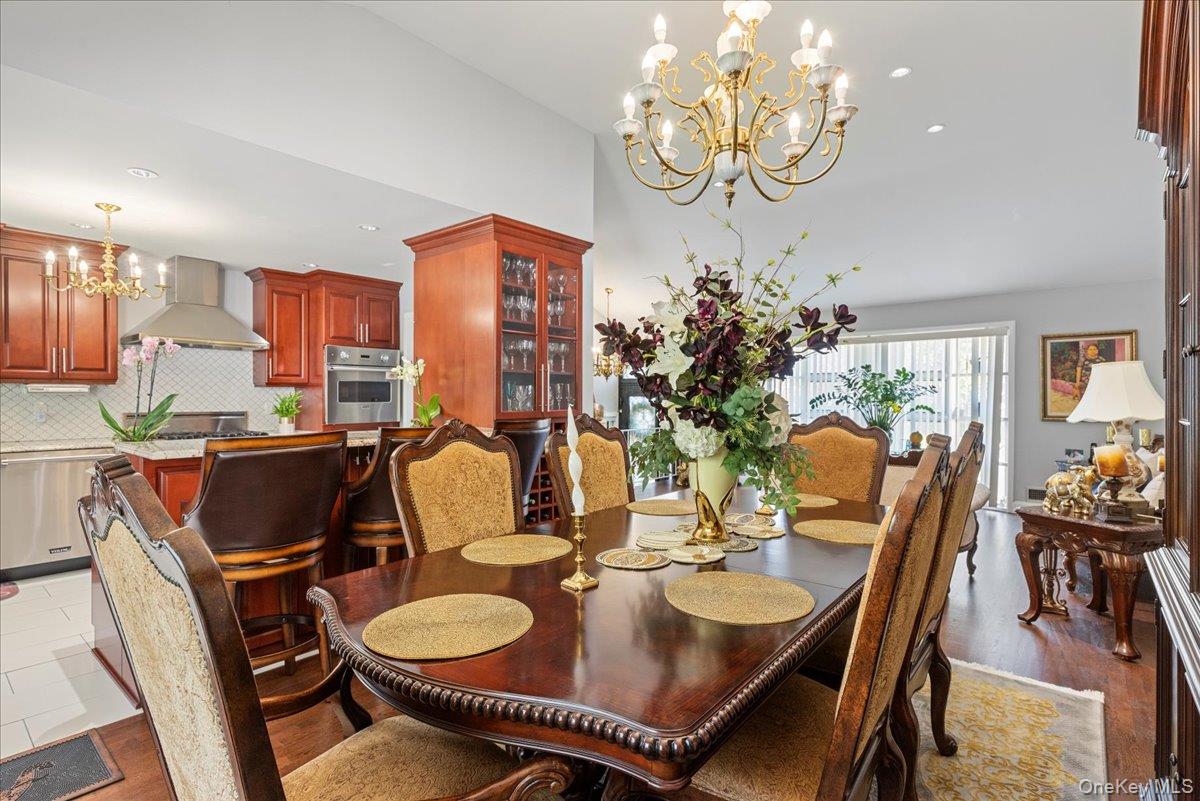 269 Hungry Harbor Road Valley Stream, NY 11581 - Photo 5 of 34 a view of a dining room with furniture and chandelier