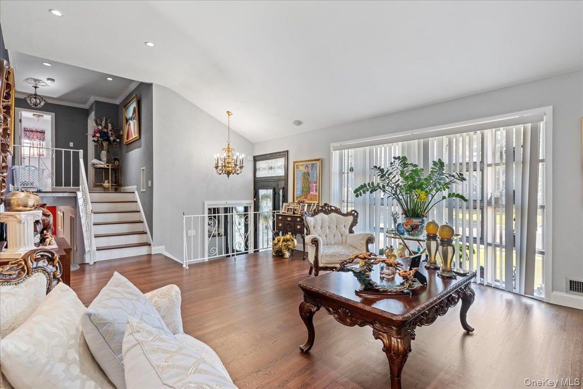 269 Hungry Harbor Road Valley Stream, NY 11581 - Photo 9 of 34 a living room with furniture and wooden floor