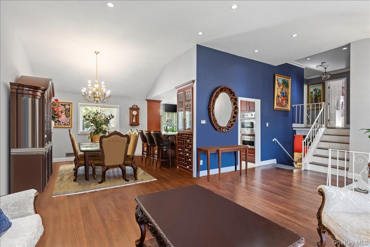 269 Hungry Harbor Road Valley Stream, NY 11581 - Photo 10 of 34 a view of a dining room with furniture a chandelier and wooden floor