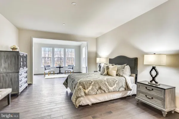 a bedroom with bed and window