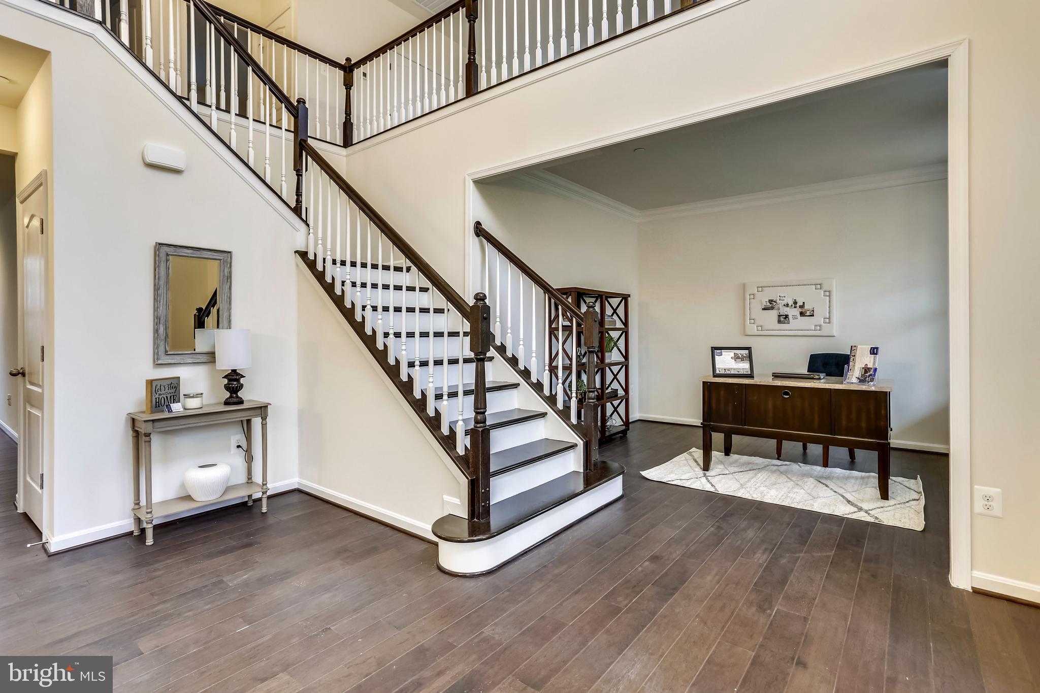 3916 Diplomat Avenue Bowie, MD 20721 - Photo 5 of 18 a view of staircase with furniture and wooden floor