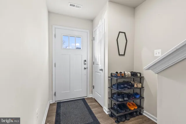 a view of a room with rack and shoes