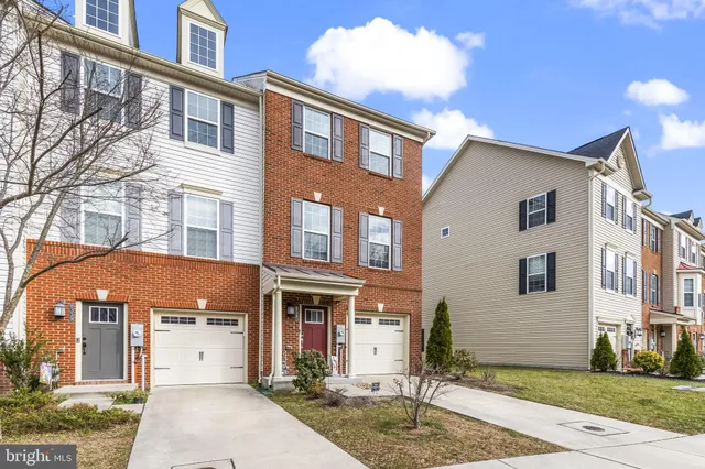 a front view of a building with a yard