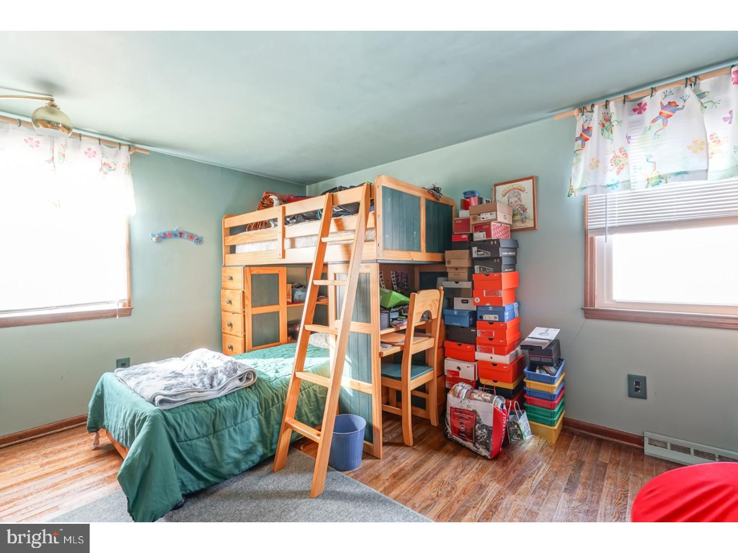 9 Deptford Road Glassboro, NJ 08028 - Photo 13 of 20 a living room with furniture and a table