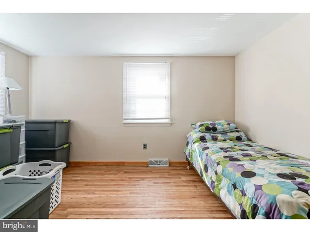 a bedroom with a bed and a table in it