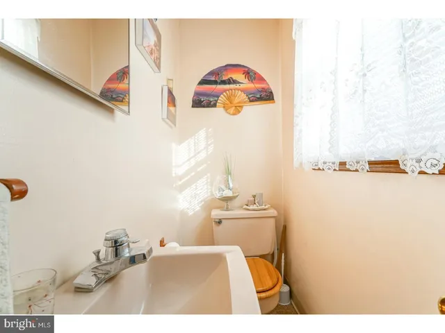 a bathroom with a sink mirror and vanity