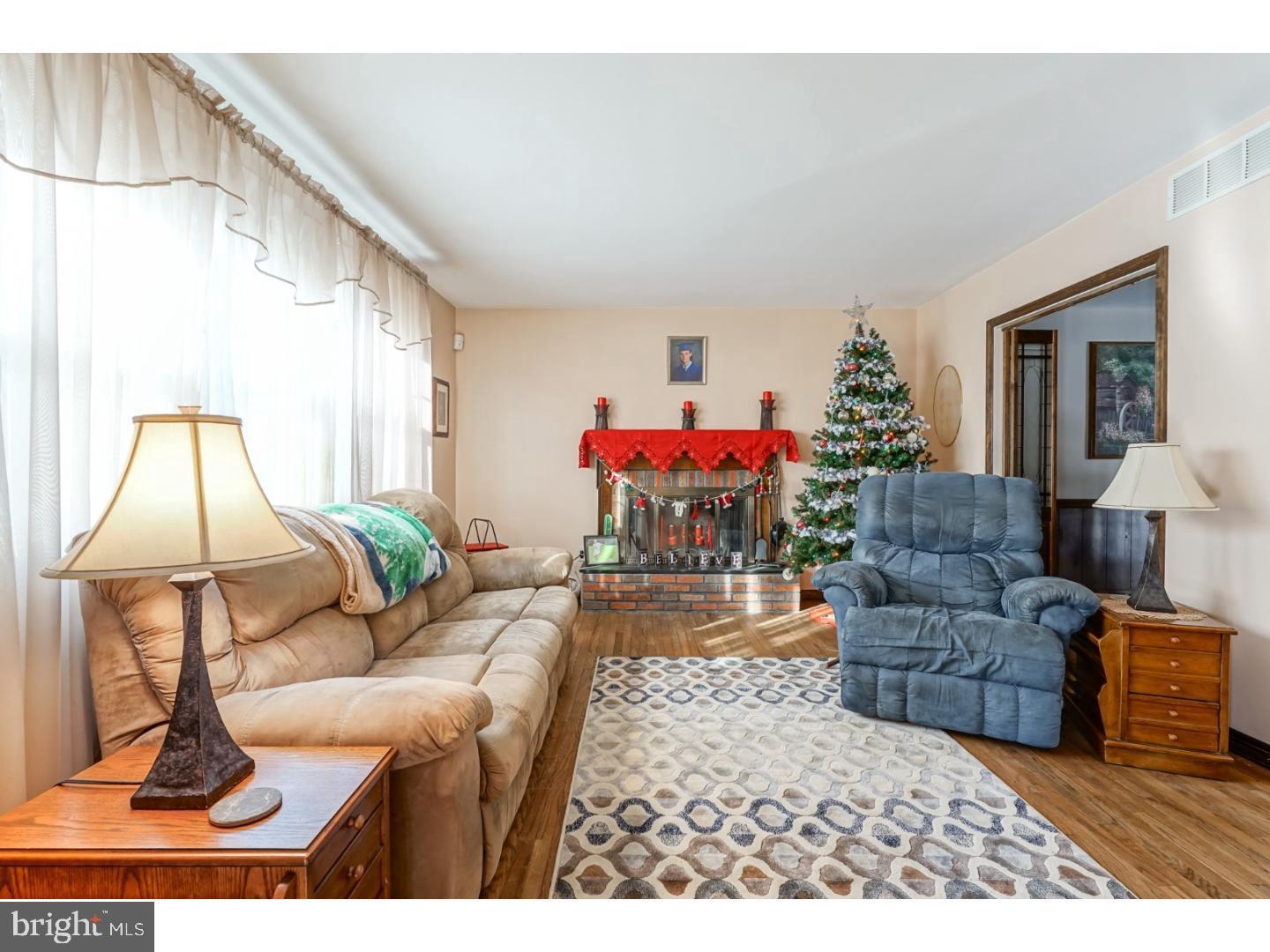 9 Deptford Road Glassboro, NJ 08028 - Photo 5 of 20 a living room with furniture flowerpot and a window
