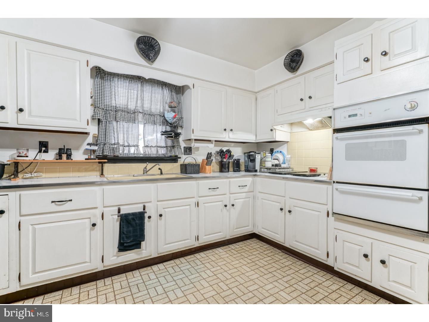 9 Deptford Road Glassboro, NJ 08028 - Photo 9 of 20 a kitchen with granite countertop white cabinets and white appliances