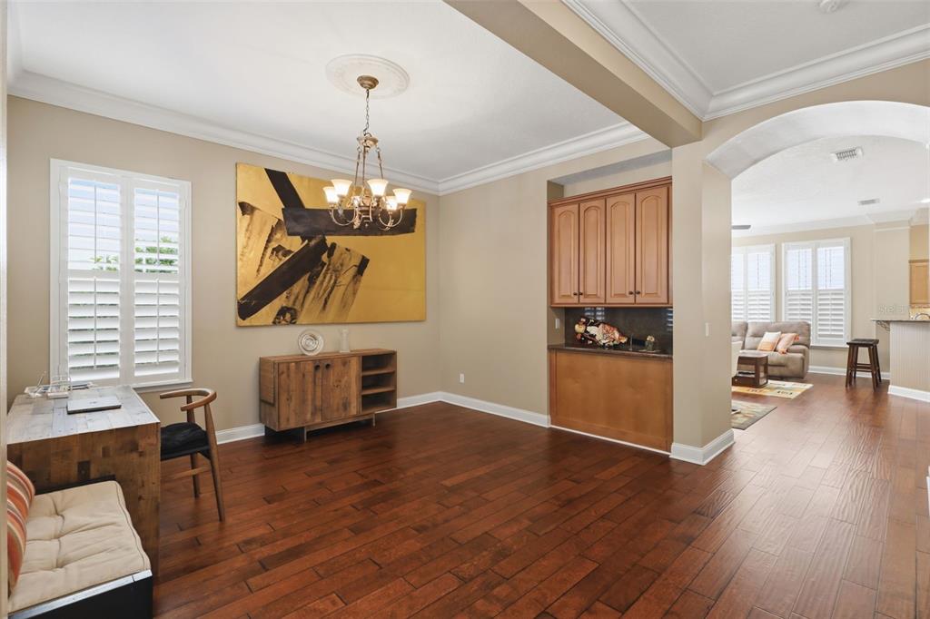 907 Pawstand Road Celebration, FL 34747 - Photo 10 of 49 a living room with furniture and a wooden floor