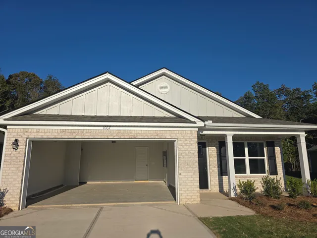 a view of house with yard
