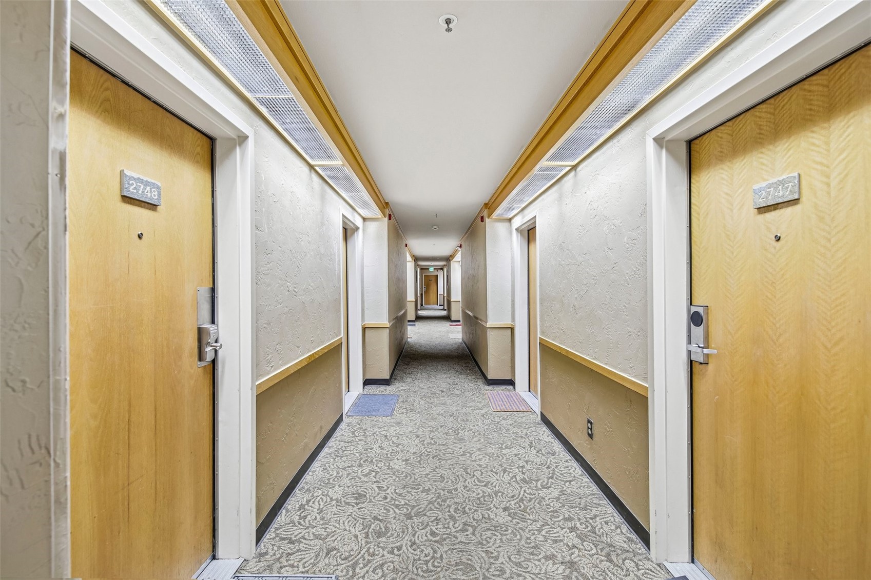 1211 West Keystone Road, Unit 2747 Keystone, CO 80435 - Photo 4 of 31 a view of hallway with stairs and wooden floor