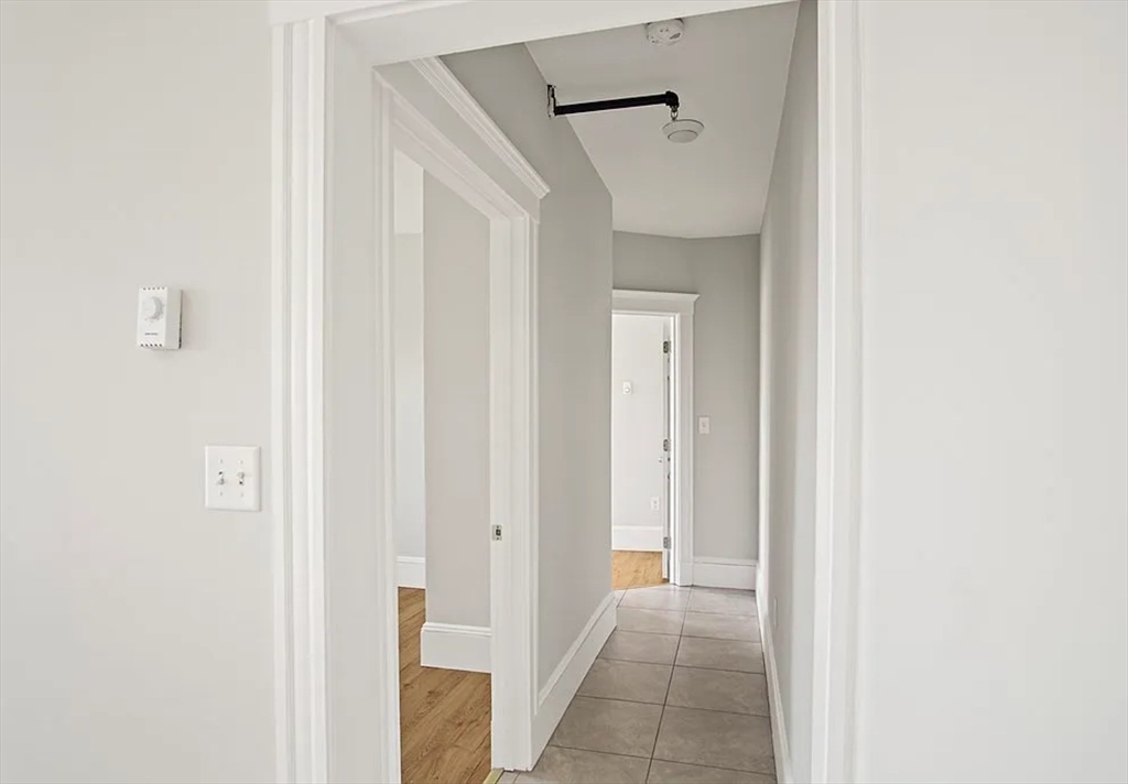 2 Redfield Street, Unit 2 Boston, MA 02122 - Photo 5 of 14 a view of a hallway