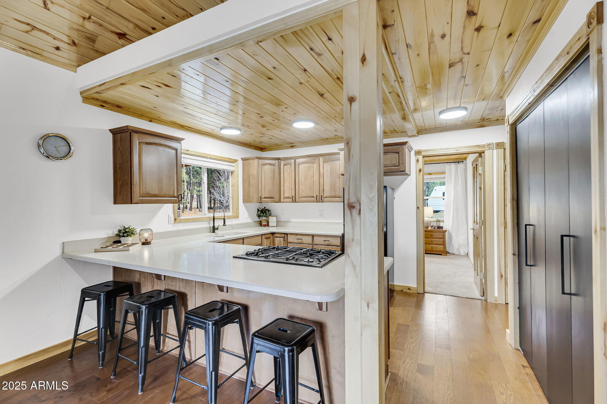5348 Forest Service 701 Road Happy Jack, AZ 86024 - Photo 8 of 59 a kitchen with stainless steel appliances granite countertop a stove a refrigerator and a dining table