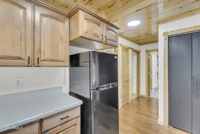 a kitchen with a stove and a window