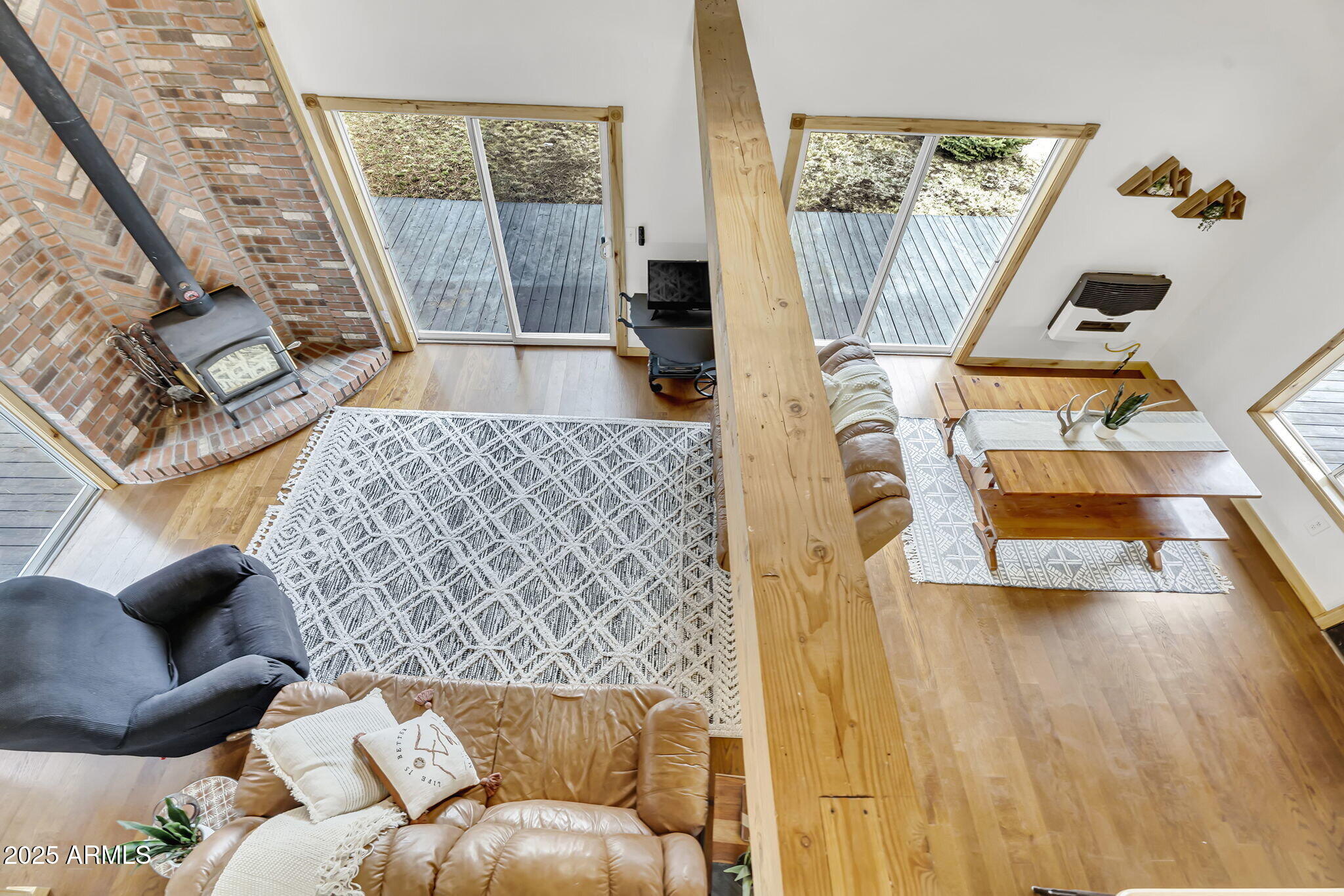 5348 Forest Service 701 Road Happy Jack, AZ 86024 - Photo 12 of 59 a living room with furniture and a floor to ceiling window
