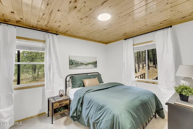 a bedroom with a bed and a walk in closet