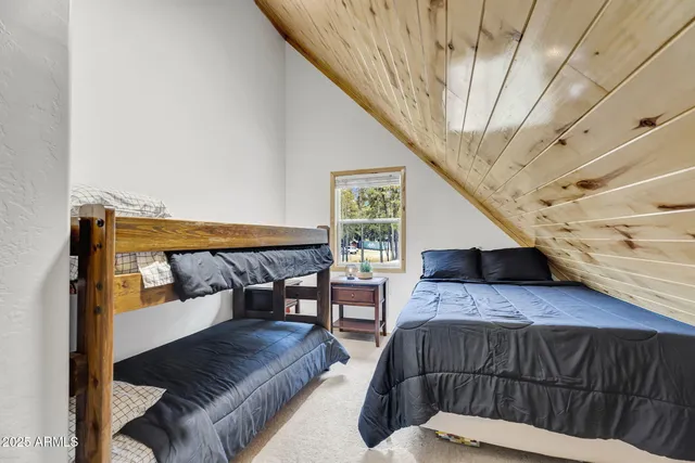 a bedroom with furniture and a wooden floor