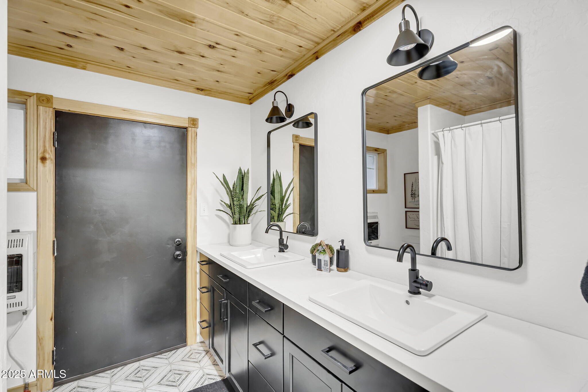 5348 Forest Service 701 Road Happy Jack, AZ 86024 - Photo 21 of 59 a bathroom with a sink and a mirror