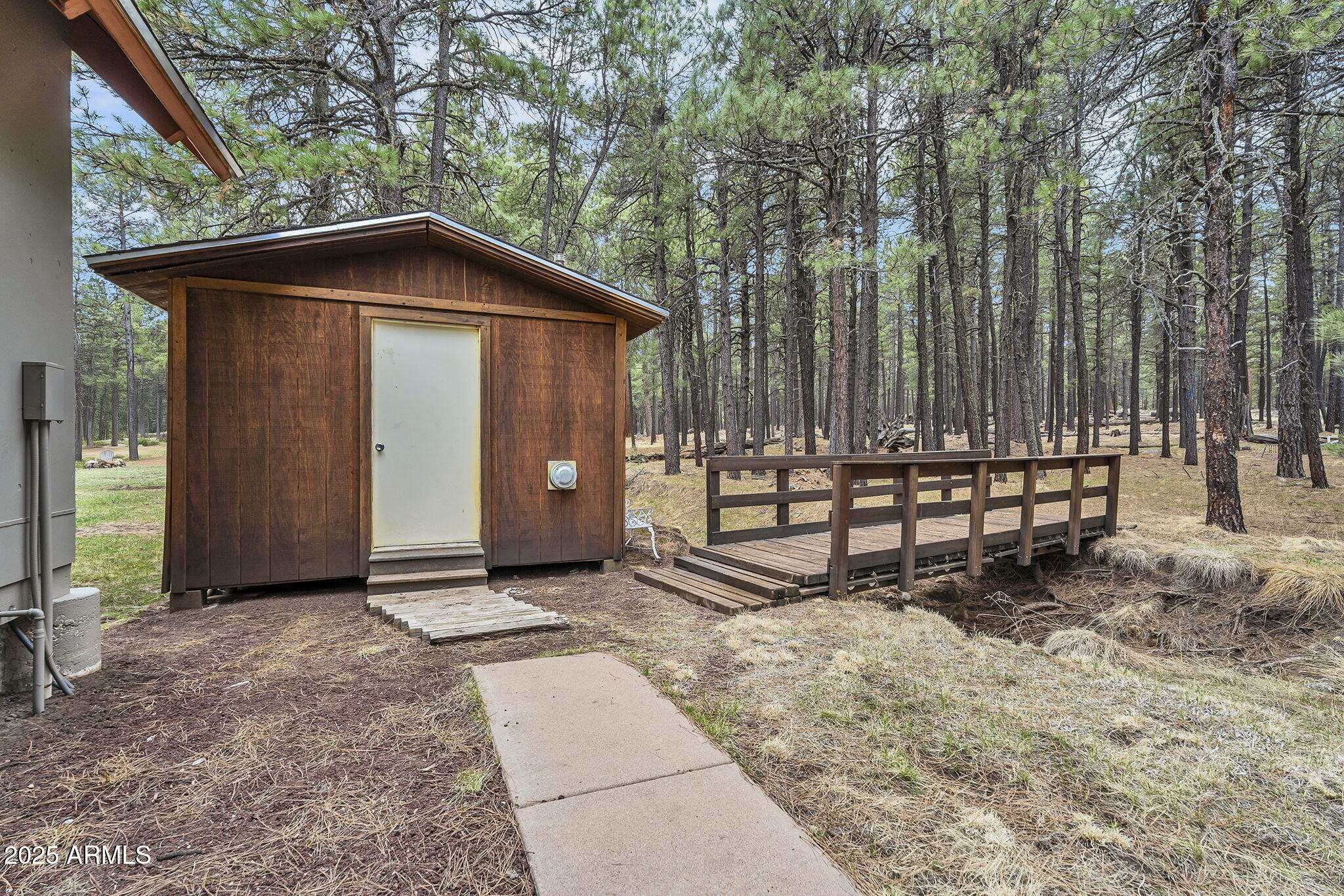5348 Forest Service 701 Road Happy Jack, AZ 86024 - Photo 31 of 59 a view of wooden house with large trees and wooden fence