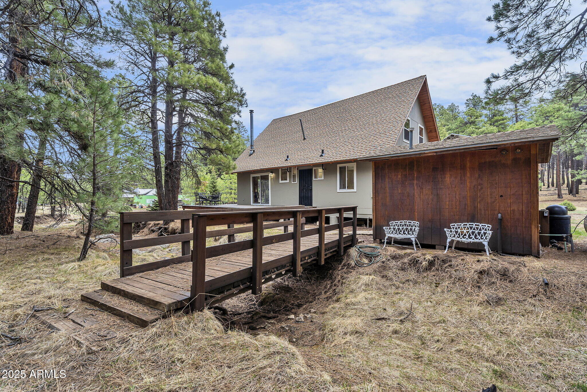 5348 Forest Service 701 Road Happy Jack, AZ 86024 - Photo 32 of 59 a view of a house with backyard and sitting area