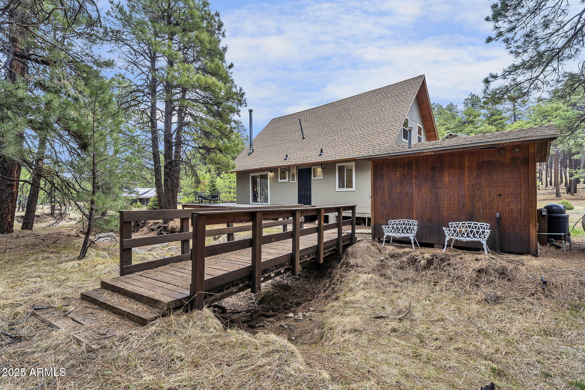 5348 Forest Service 701 Road Happy Jack, AZ 86024 - Photo 33 of 59 a view of a house with backyard and sitting area