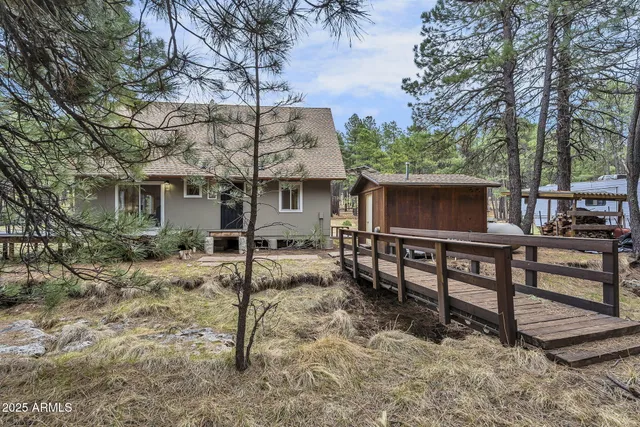 a view of a bench with chairs in roof deck