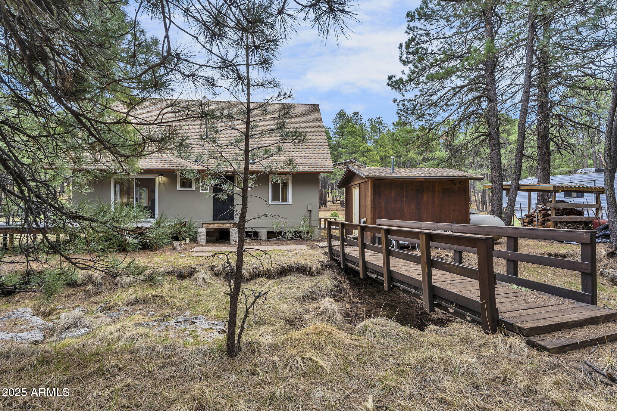 5348 Forest Service 701 Road Happy Jack, AZ 86024 - Photo 34 of 59 a view of a chairs and table in the backyard