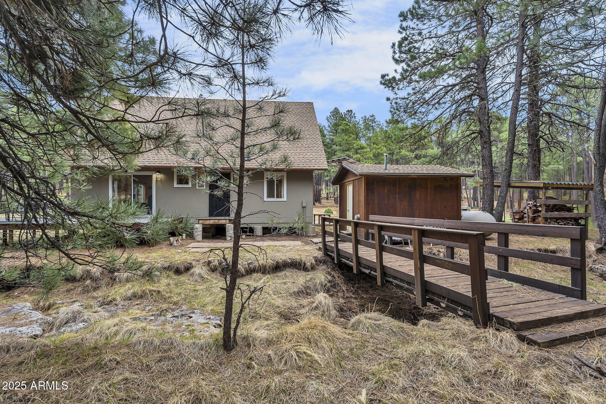 5348 Forest Service 701 Road Happy Jack, AZ 86024 - Photo 35 of 59 a view of a chairs and table in the backyard