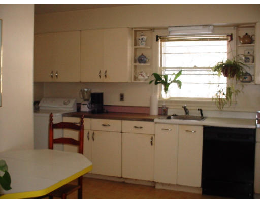 91 Grant Street Lexington, MA 02420 - Photo 6 of 8 a kitchen with a sink cabinets and window
